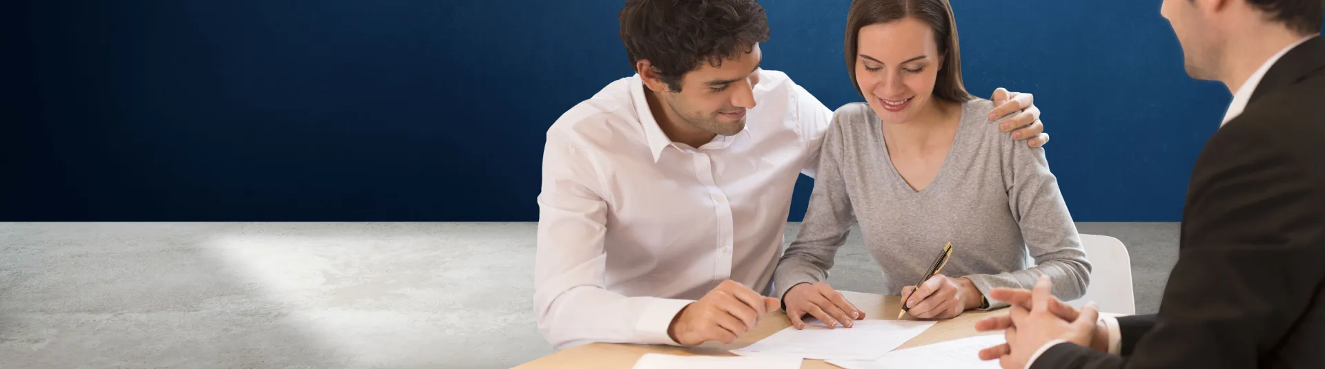 masthead couple signing papers